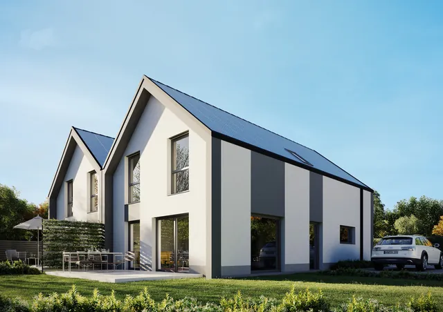 Doppelhaus in Isenbüttel mit Solardach und grauen Fassadenstreifen